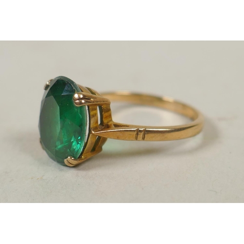 633 - 18ct gold ring set with three turquoise stones, size M, 3.8g, and a 9ct gold dress ring set with a g... 