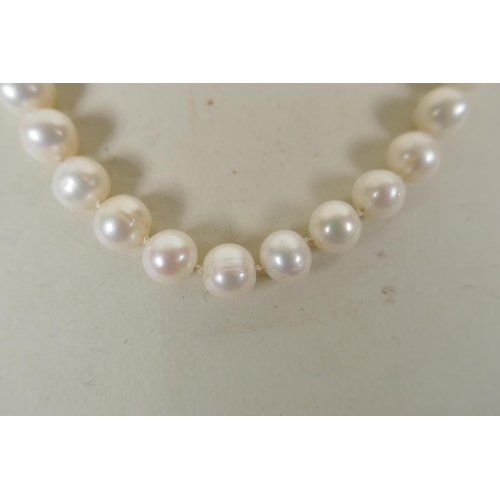 634 - Pearl necklace with 9ct clasp, and another with 925 silver clasp, largest 52cm