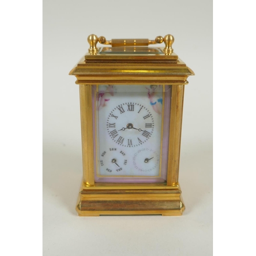 635 - A miniature gilt brass carriage clock with Sevres style paste panels, the dial with day and date sub... 