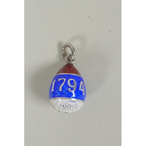 637 - A Russian silver and guilloche enamel egg pendant bearing the dates 1794 and 1894