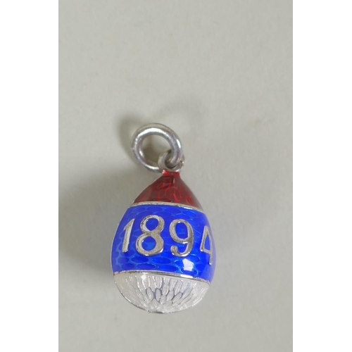 637 - A Russian silver and guilloche enamel egg pendant bearing the dates 1794 and 1894