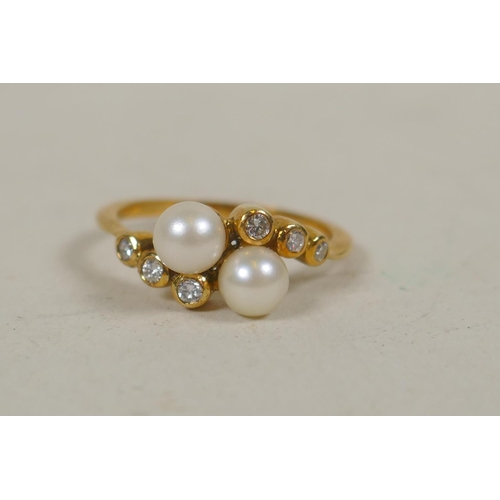 638 - 18ct gold ring set with two pearls and six small diamonds, size O/P, 3.5g gross