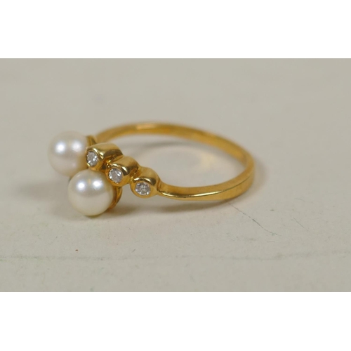 638 - 18ct gold ring set with two pearls and six small diamonds, size O/P, 3.5g gross