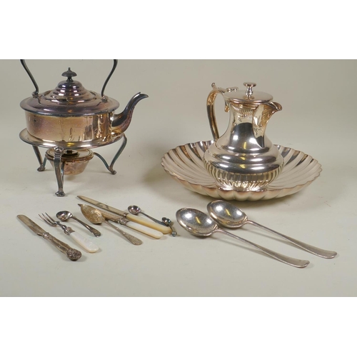 658 - A silver plated spirit kettle with stand, tea pot and fluted bowl, silver and mother of pearl knives... 