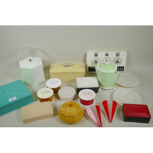 66 - A collection of vintage plastic, bakelite and acrylic items, vanity case, 18 x 23 x 6cm, and a pair ... 