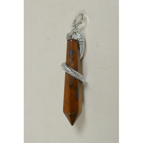 667 - A metal mounted tiger's eye point pendant, with serpent decoration, 6cm 