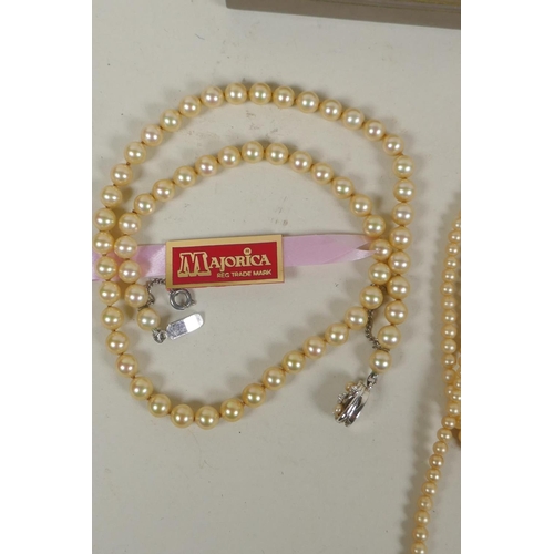 674 - A collection of pearl necklaces, pendants, studs, earrings and loose beads