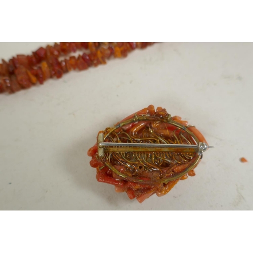 675 - A long string of natural amber, 46g, 168cm long, and a vintage coral brooch