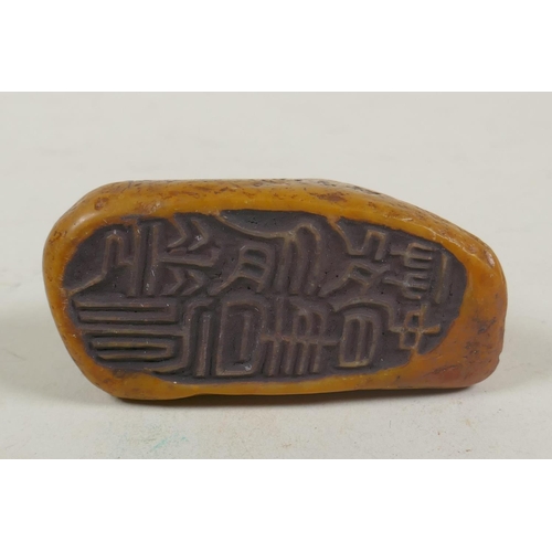 68 - A Chinese carved soapstone seal with a kylin knop, 9cm long