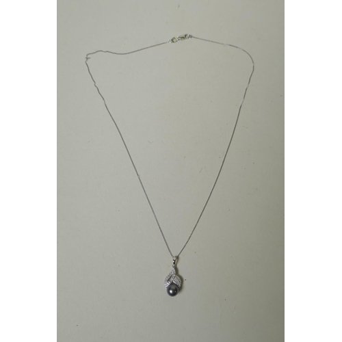 682 - 9ct white gold pendant set with diamonds and a Tahitian pearl, on a chain, 3.2g gross