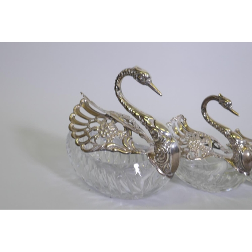 684 - Set of five hallmarked sterling silver mounted cut glass bowls in the form of swans, AF one wing det... 