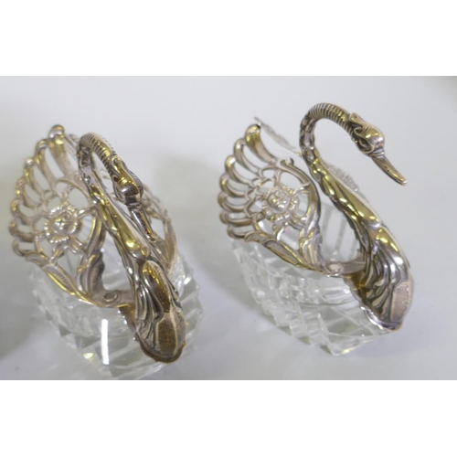 684 - Set of five hallmarked sterling silver mounted cut glass bowls in the form of swans, AF one wing det... 