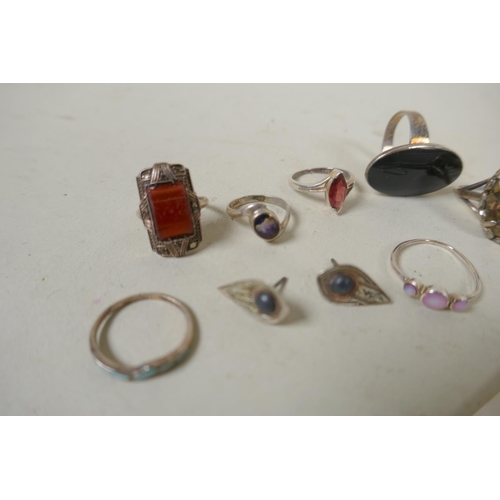 689 - A collection of silver rings, set with gemstones and enamel decoration, and white metal costume jewe... 