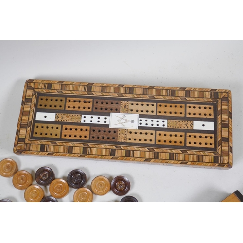 71 - An inlaid cribbage board with compass and mitre decoration, 31 x 11.5 x 3cm