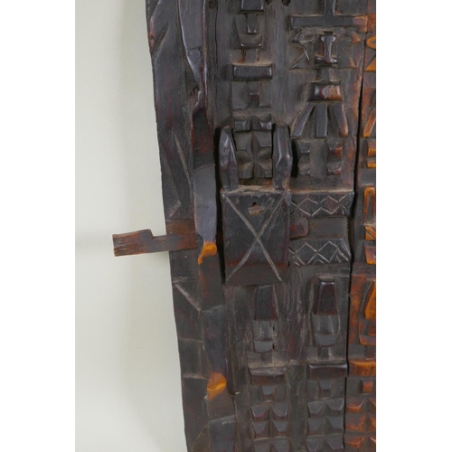 73 - An African carved wood Dogon Granary Door, 37 x 55cm