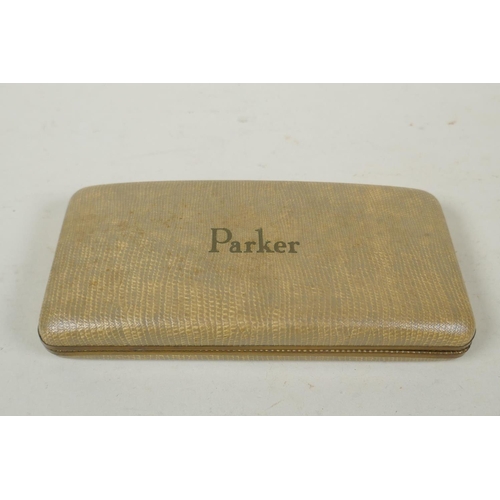 75 - A vintage Parker 51 three pen case containing a pair of fountain pens with rolled gold caps and matc... 