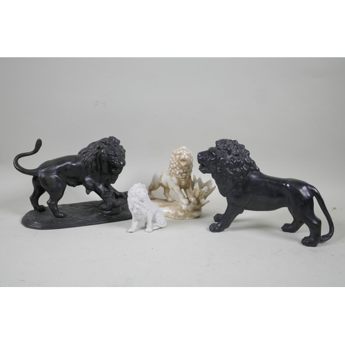 76 - A C19th patinated white metal figure of a lion and serpent, 15cm high, another of a standing lion, p... 