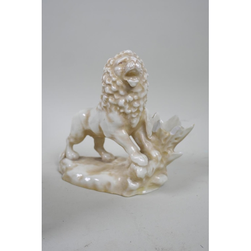 76 - A C19th patinated white metal figure of a lion and serpent, 15cm high, another of a standing lion, p... 