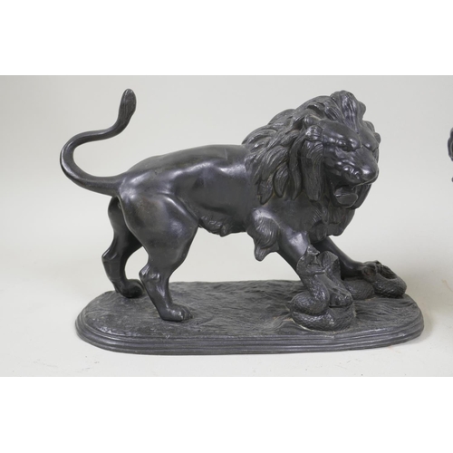 76 - A C19th patinated white metal figure of a lion and serpent, 15cm high, another of a standing lion, p... 