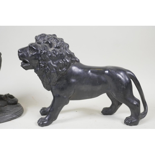 76 - A C19th patinated white metal figure of a lion and serpent, 15cm high, another of a standing lion, p... 