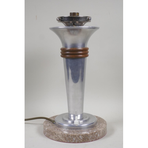 79 - An Art Deco aluminium table lamp with wooden ring decoration mounted on a marble base, 31cm high