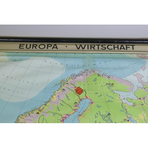 84 - A Georg Westerman German roll down map of Europe showing countries and commodities, paper on linen, ... 