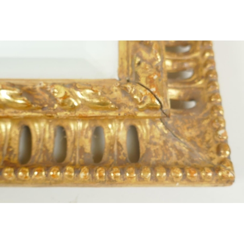 848 - A C19th Florentine carved and watergilt frame with pierced border and inset with bevelled mirror gla... 