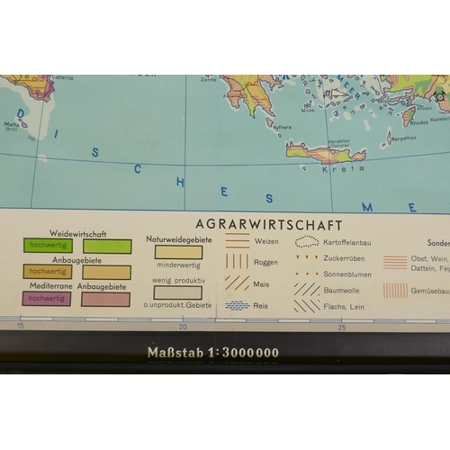 86 - A Fennings German roll down map of Europe showing commodities, 220 x 165cm