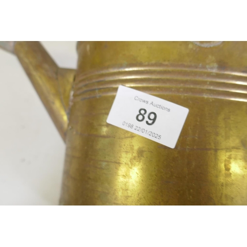 89 - An antique brass watering can, stamped H.J. Hookham & Sons, Birmingham, 25cm high; a Haws patent... 