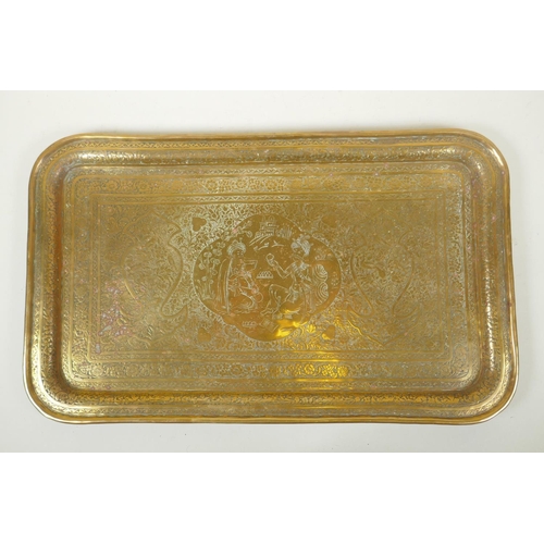 92 - A Persian brass tray with cased decoration of Sha Abbas, 53 x 32cm