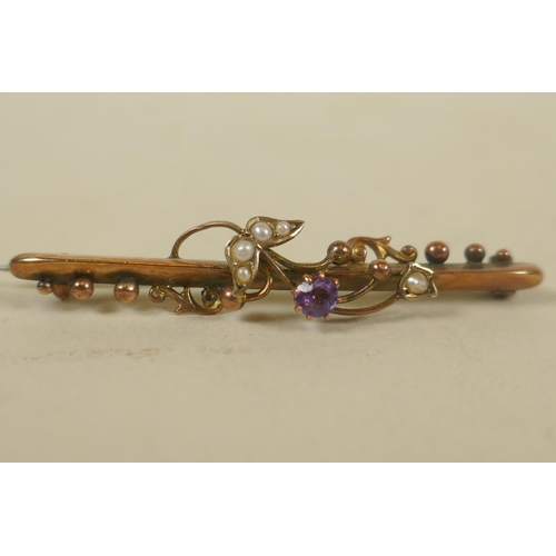 696 - An Edwardian 9ct gold bar brooch, set with seed pearls and amethysts, Birmingham 1907, Sydenham Bros... 