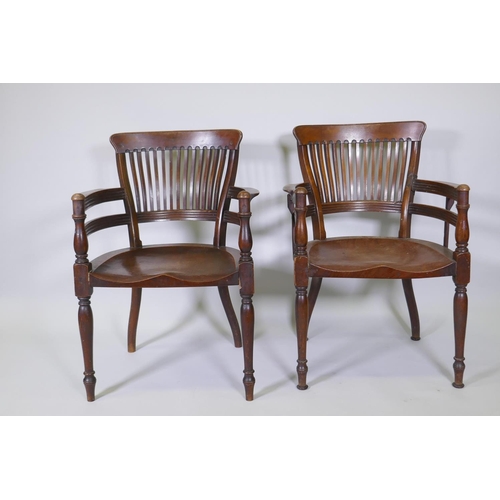 1003 - A pair of Arts & Crafts mahogany open armchairs in the manner of E.W. Godwin, with shaped lathe ... 