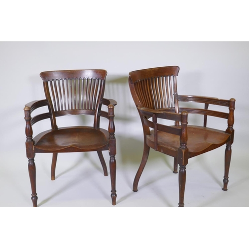 1003 - A pair of Arts & Crafts mahogany open armchairs in the manner of E.W. Godwin, with shaped lathe ... 