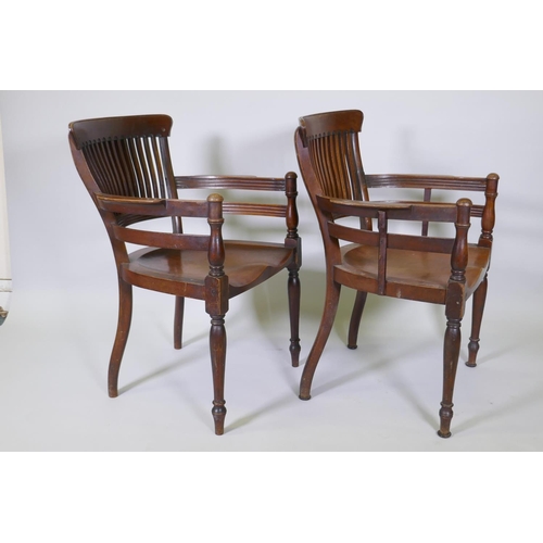 1003 - A pair of Arts & Crafts mahogany open armchairs in the manner of E.W. Godwin, with shaped lathe ... 