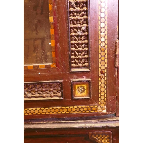 1006 - Late C91th Ottoman inlaid pine armoire with Moorish decoration and carved inscription, the two arche... 