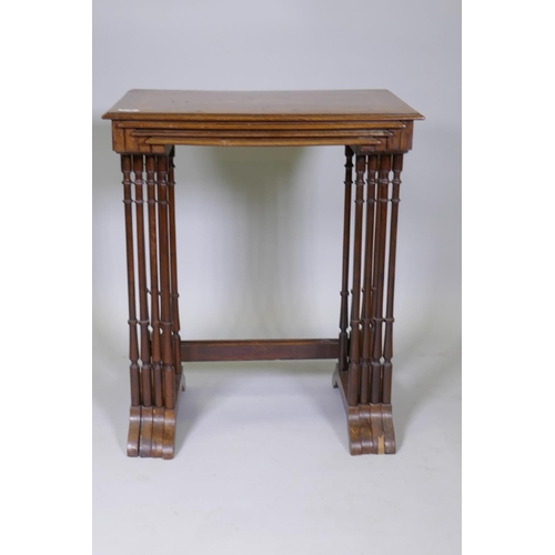 1009 - A nest of four inlaid kingwood occasional tables, raised on slender ring turned supports, 60 x 40 x ... 