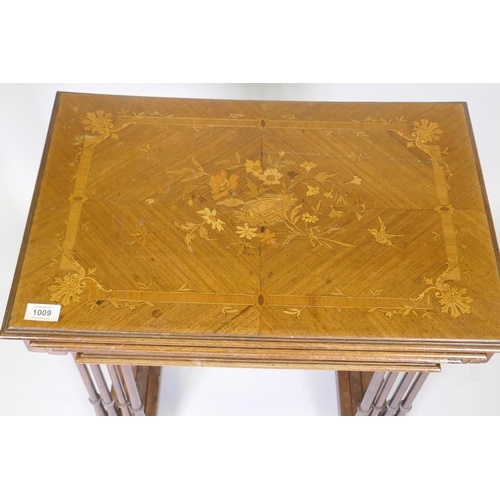 1009 - A nest of four inlaid kingwood occasional tables, raised on slender ring turned supports, 60 x 40 x ... 