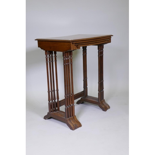 1009 - A nest of four inlaid kingwood occasional tables, raised on slender ring turned supports, 60 x 40 x ... 