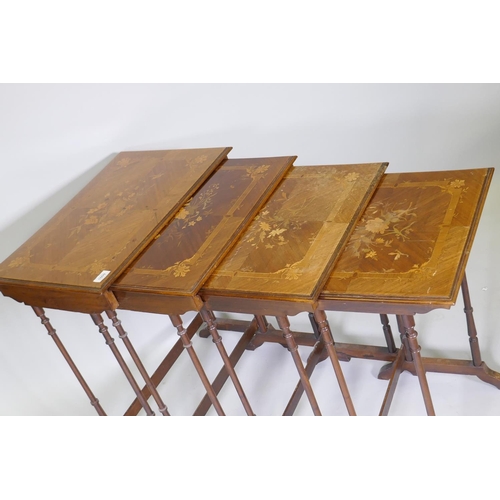 1009 - A nest of four inlaid kingwood occasional tables, raised on slender ring turned supports, 60 x 40 x ... 