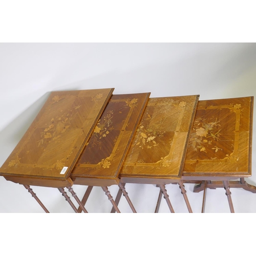 1009 - A nest of four inlaid kingwood occasional tables, raised on slender ring turned supports, 60 x 40 x ... 