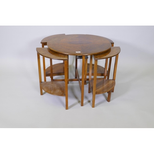 1011 - A 1930s figured walnut nest of five tables, 61cm diameter x 54cm high