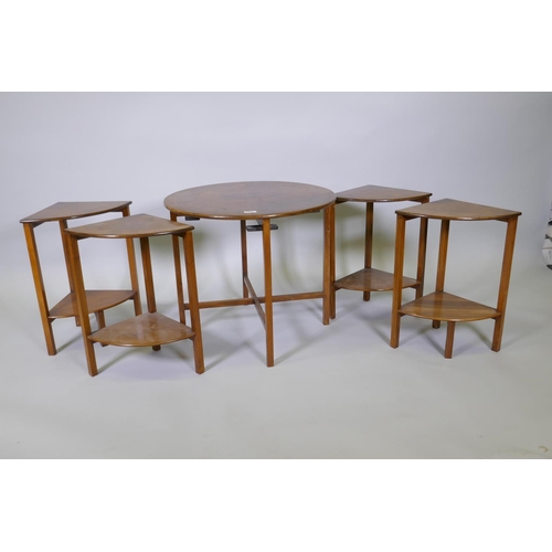 1011 - A 1930s figured walnut nest of five tables, 61cm diameter x 54cm high