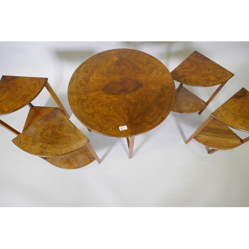 1011 - A 1930s figured walnut nest of five tables, 61cm diameter x 54cm high