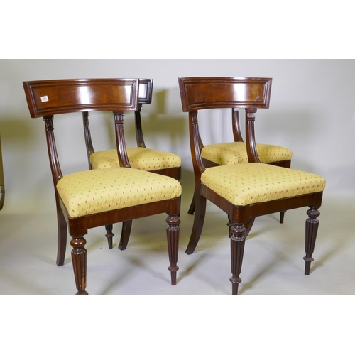 1024 - A good set of four early C19th mahogany bar back hairs, with moulded backs and pad seats, raised on ... 