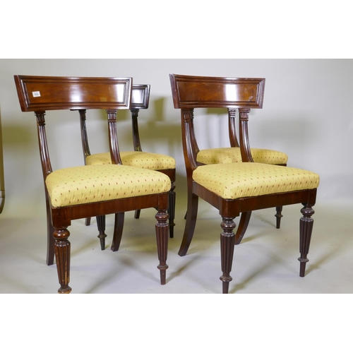 1024 - A good set of four early C19th mahogany bar back hairs, with moulded backs and pad seats, raised on ... 