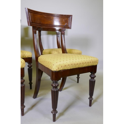 1024 - A good set of four early C19th mahogany bar back hairs, with moulded backs and pad seats, raised on ... 