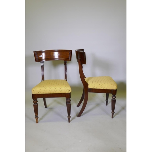 1024 - A good set of four early C19th mahogany bar back hairs, with moulded backs and pad seats, raised on ... 