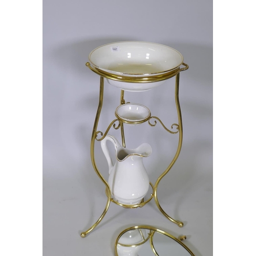 1027 - A brass washstand with jug, bowl and dish and matching mirror, AF adapted, 77cm high