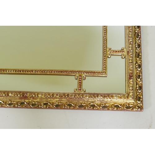 1028 - A giltwood and composition sectional wall mirror, 83 x 53cm