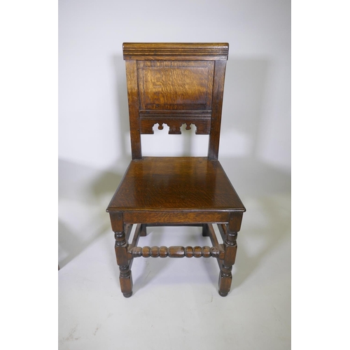 1031 - A set of eight William and Mary style panel backed oak chairs, with solid seats, raised on turned su... 